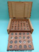 A small coin cabinet containing a quantity of Roman coins