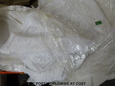 Three boxes of net curtains and similar material