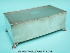 An Art Deco hallmarked silver engine turned cigarette case Birmingham 1935, maker's marks rubbed,