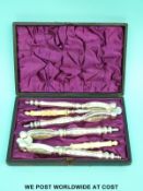 A cased pair of silver plated nutcrackers and picks with 1885 date to case