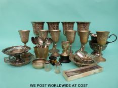 A pair of Victorian hallmarked silver napkin rings (60g) together with a small pepper,