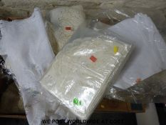 Four boxes containing a large collection of lace and similar material runners and table covers