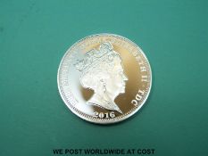 A cased 'The 80th Anniversary of The Spitfire' silver coin with certificate of authenticity