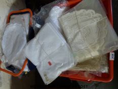 Four boxes containing a large quantity of table runners and similar furniture covers etc.