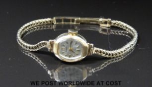 Mappin 9ct gold ladies wristwatch with black hands and gold markers on 9ct gold bracelet,