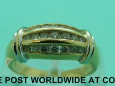 An 18ct gold ring set with three rows of diamonds (size R)