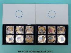 Twelve boxed coins with banknote embellishments