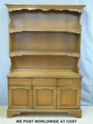 An mahogany dresser with plate rack above (W138 x D46 x H202cm)