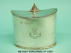 A George V hallmarked silver tea caddy of Georgian design with acanthus leaf finial,
