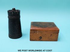 A carved treen snuff box/needle case in the form of a keep or rook chess piece and a Mauchline ware