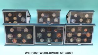 Six deluxe cased Royal Mint proof coin sets 1983-1988 with certificates