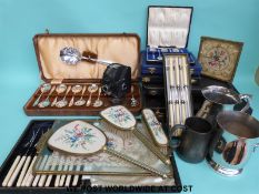 A quantity of silver plated items including cased cutlery sets, gilt edge dressing table set,