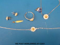 A white metal pendant marked 10k set with an amethyst and a suite of silver jewellery in the form