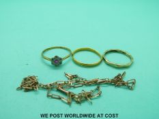 A yellow metal ring marked 18ct gold set with a ruby surrounded by diamonds (1.