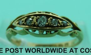 An 18ct gold ring set with five diamonds (size M)