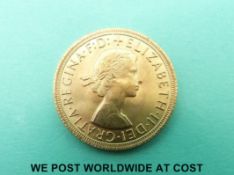 A 1965 Elizabeth II first head gold full sovereign