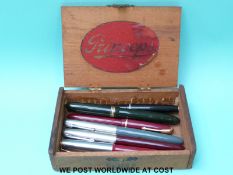 A collection of vintage pens including Swan, Osmiroid, Parker,