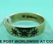 A 9ct gold ring set with three sapphires (3.
