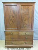 A 19thC mahogany linen press, the top section opening to reveal slide out top,
