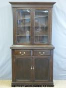 A late 19thC/early 20thC mahogany bookcase, the top section with sawtooth adjustable shelves,