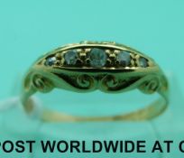 An 18ct gold ring set with five diamonds (size O)