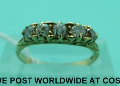 A Victorian 18ct gold ring set with five old cut diamonds (size L)