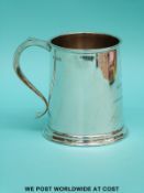 An Elizabeth II hallmarked silver pint tankard of tapering form,