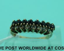 A 9ct gold ring set with a row of sapphires and a row of paste (size K)