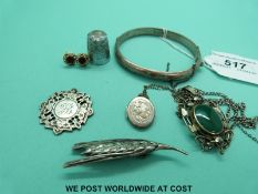 A pair of 9ct gold earrings set with a garnet, a Charles Horner thimble, silver brooch,