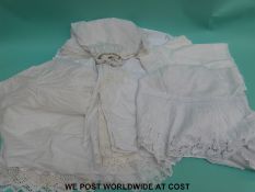 A quantity of Edwardian ladies under garments to include undershirts and skirts