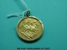 A 1888 full sovereign in 9ct gold mount (9g)