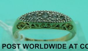 An 18ct gold ring set with five diamonds in a platinum setting (size K)