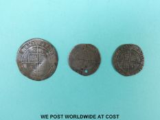 An Elizabeth I 1561 six pence, together with two three pence pieces 1568 and 1570,