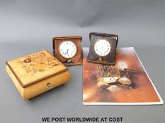 Two early 20thC leather cased Swiss 8 day travelling clocks,