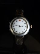 Rolex silver ladies wristwatch with Roman numerals and gilt markers to the white enamel face,