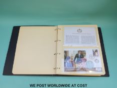 A coin / stamp cover album to celebrate the Queen's 80th birthday