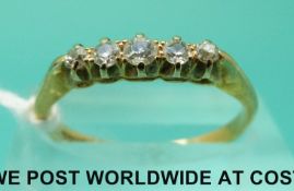 An 18ct gold ring set with five old cut diamonds (size M)