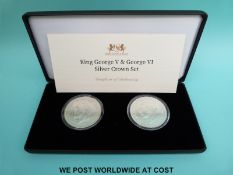 Cased King George V and George VI silver crown set with certificate of authenticity