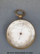 A 19th/20th century compensated pocket barometer in brass case;