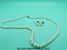 A cultured pearl necklace with 9ct gold clasp and a pair of 9ct gold earrings set with a pearl to