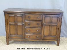 An Ercol style sideboard (W145 x D50 x H90cm)