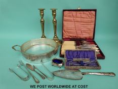 A cased 12-piece fish knife and fork set with bone handles, brass candlesticks,