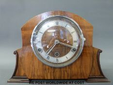 A 1930s three train walnut cased mantel clock, British made movement no.