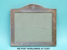 A George V hallmarked silver photograph frame by Goldsmiths & Silversmiths Company,