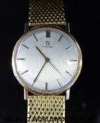 Omega 9ct gold gentleman's wristwatch with gold hands and two-tone baton markers and brushed steel