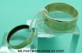 A 9ct gold wedding ring and a yellow metal wedding ring (7.