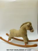 Merrythought soft rocking horse on curved wooden base