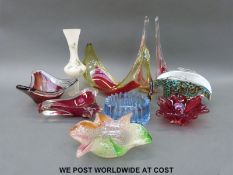 A collection of art glass bowls and vases