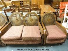An Art Deco walnut bergere three piece suite,