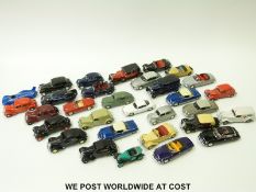 Thirty-one Solido diecast model classic cars.